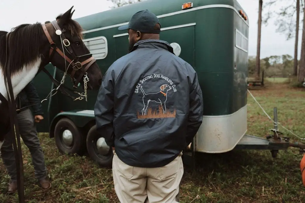 GA-FLA Shooting Dog Handlers Club jacket at the green trailer