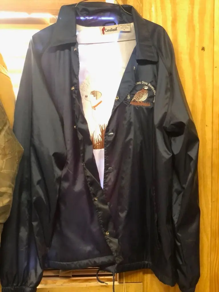 GA-FLA club jacket hanging in the kennel shed