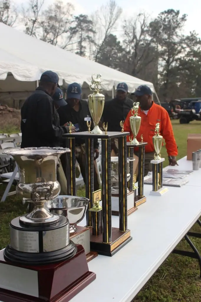 Champion dog and handlers with the silver