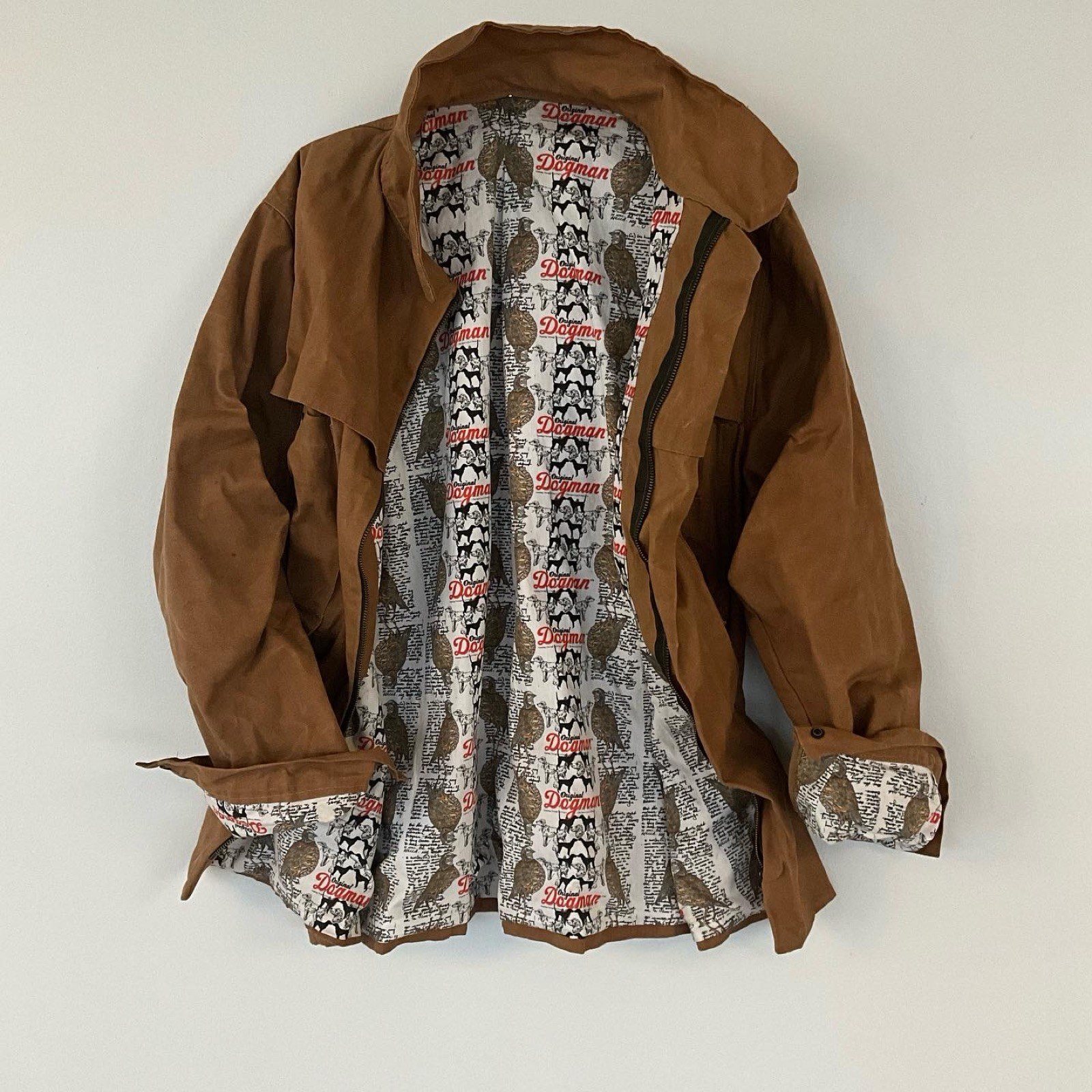 Original Dogman Waxed Cotton Jacket — open, showing the custom-printed lining